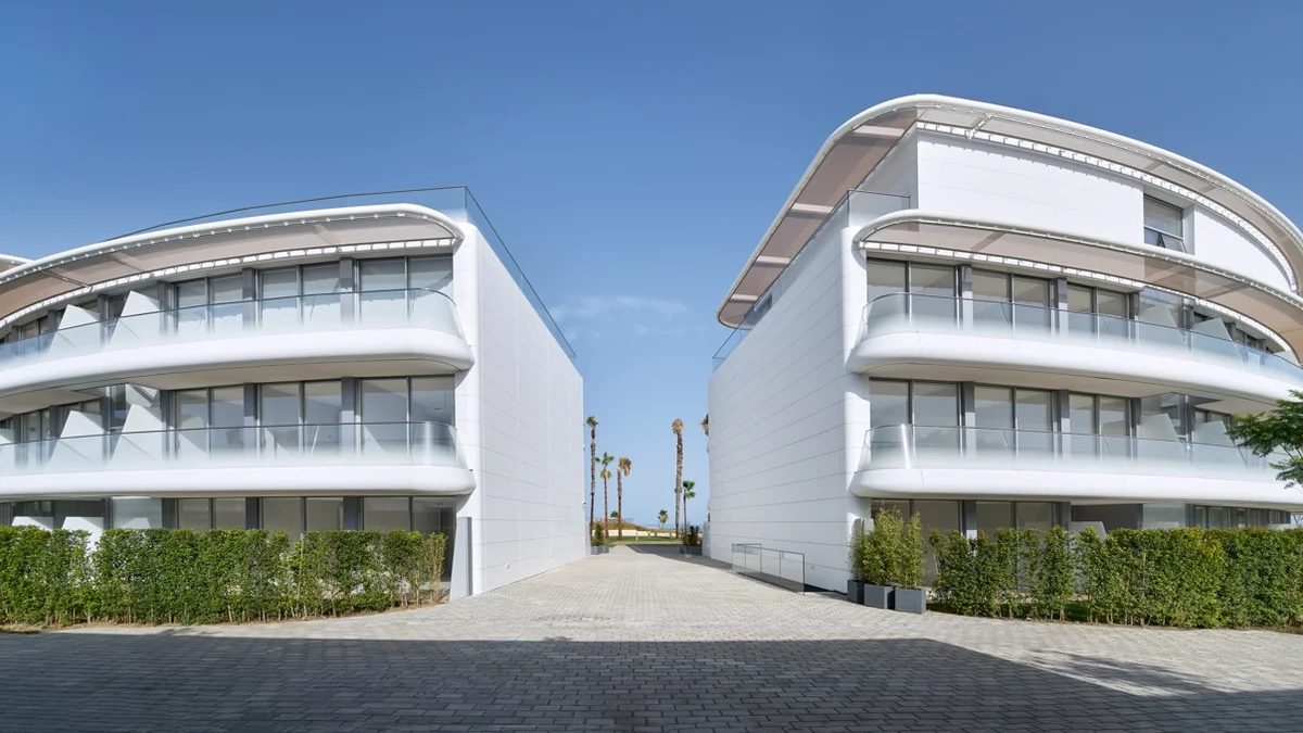 The Edge Estepona: two curved white apartment buildings by Rafael de la Hoz