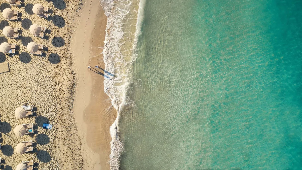 Sandy shoreline of Cala Tarida beach near Villas de Onar, Ibiza
