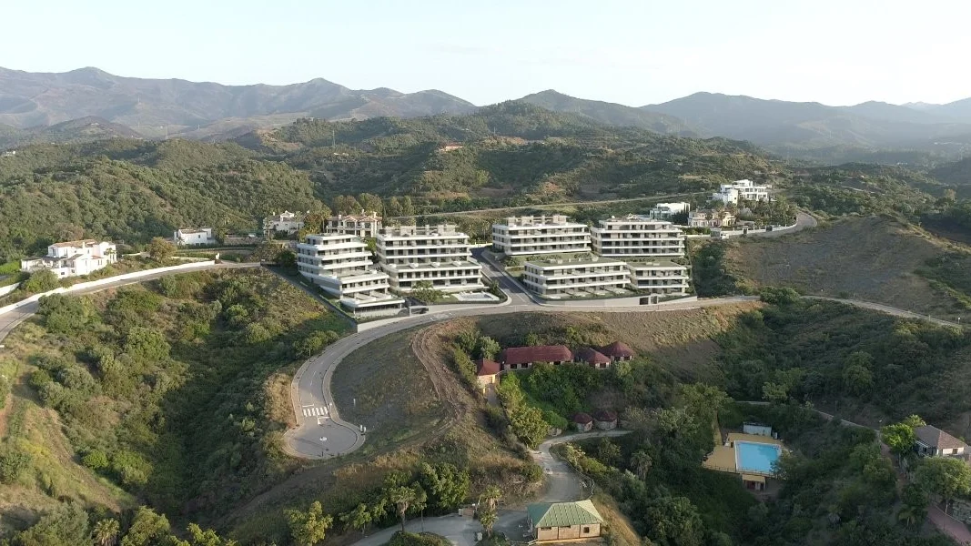 Aerial view of the AEDAS Homes Libella development on the hillside above Estepona