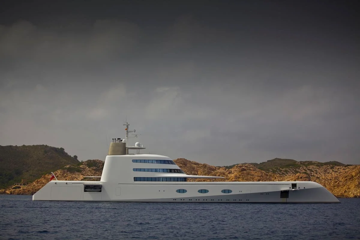 Motor yacht at anchor under an overcast sky